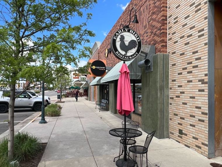 Sidewalk dining and shopfronts along the Bradburn Village core